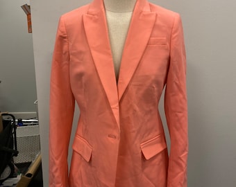 May include: A coral pink blazer with a single button closure and two front pockets.