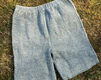 May include: Gray ribbed knit shorts with a drawstring waist.