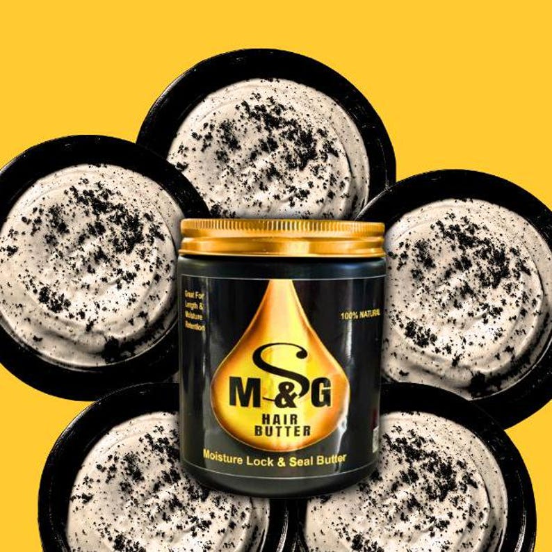 May include: A black jar with a gold lid and a gold label that says "M&G Hair Butter Moisture Lock & Seal Butter" with a gold drop design. The jar is surrounded by five white jars with black specks.