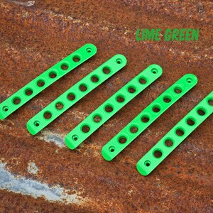 May include: Five lime green, elongated, rectangular plastic strips, each featuring a series of circular holes and two smaller mounting holes at the ends. The text LIME GREEN is printed in the upper right corner of the image.