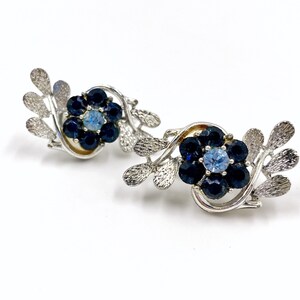 Coro silver tone and blue rhinestone  floral with leaves clip on earrings.  Excellent condition!  Beautiful gift for mom!