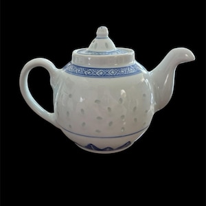 May include: A handmade, wooden serving tray with a natural finish. The tray features a rectangular shape with rounded corners and two carved handles. The wood grain is visible, adding to its rustic charm. Perfect for serving food or displaying items.