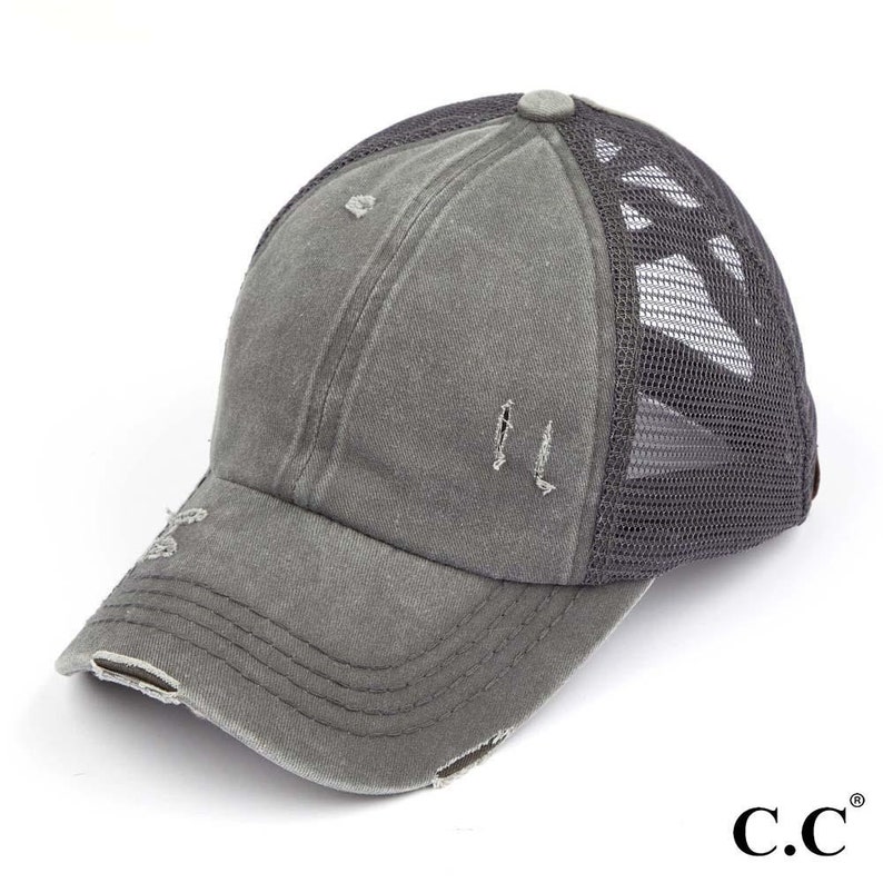 May include: Gray distressed baseball cap with a mesh back. The cap has a curved brim and a faded, worn appearance. The brand logo "C.C." is visible on the lower right.