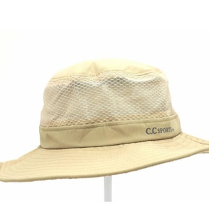 May include: A beige sun hat with a wide brim and a mesh crown. The hat has a band around the base of the crown with the text "C.C. SPORTS". The hat is designed for outdoor activities.