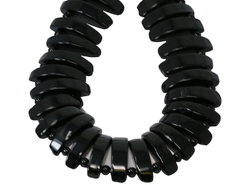 May include: A black hair scrunchie made of multiple overlapping pieces of plastic.