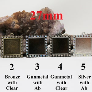 May include: Six 27mm square pendant trays with a clear glass insert and a rhinestone border. The trays are available in bronze with ab, bronze with clear, gunmetal with ab, gunmetal with clear, silver with ab, and silver with clear.