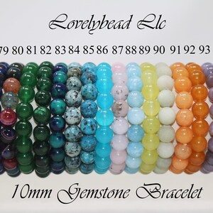 May include: A set of 17 gemstone bracelets, each with 10mm beads. The bracelets are arranged in a row, with the colors ranging from blue to brown. The bracelets are labeled with numbers from 78 to 94.