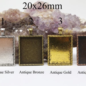May include: Four 20x26mm rectangular pendant trays in antique silver, antique bronze, antique gold, and antique copper finishes. Each tray has a rope-like border.