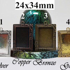 May include: Four 24x34mm metal picture frames with ornate designs. The frames are in silver, copper, bronze, and gold finishes.
