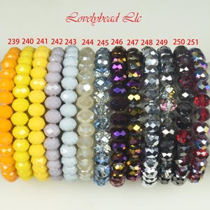 May include: A collection of beaded bracelets in various colors, including orange, yellow, lavender, and shades of blue, purple, and red. The bracelets are labeled with numbers 239 through 251. The text "Lovelybead llc" is at the top.