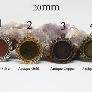 May include: Four 20mm round metal pendant trays in antique silver, gold, copper, and bronze finishes. Each tray has a decorative filigree design around the edge.