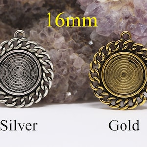 May include: Two round pendant trays, one silver and one gold, each with a chain-link border and a central recessed area. The text "16mm" is above the pendants, and the words "Silver" and "Gold" are below.