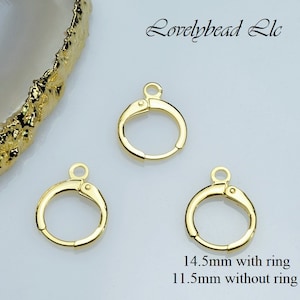 May include: Three gold-toned jump rings with a hinged opening. The rings measure 14.5 mm with the ring and 11.5 mm without the ring.