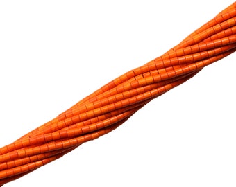 May include: A strand of bright orange cylindrical beads, made of natural coral, arranged in a spiral pattern.