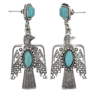 May include: Silver tone dangle earrings with turquoise stones and a stylized bird design.