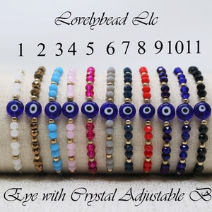 May include: Eleven adjustable bracelets with blue evil eye charms. Each bracelet features different colored crystal beads, including white, gold, turquoise, pink, fuchsia, gray, navy blue, red, dark blue, and black.