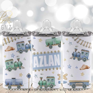 May include: Three stainless steel tumblers with a white background and a train theme. The tumblers feature a blue train, a green train, and a blue train car. The tumblers have a clear lid with a silicone spout. The middle tumbler has the name "Azlan" printed on it.
