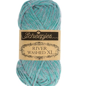 May include: A skein of Scheepjes River Washed XL yarn in a teal and purple colorway. The yarn is a bulky weight and is perfect for knitting or crocheting.