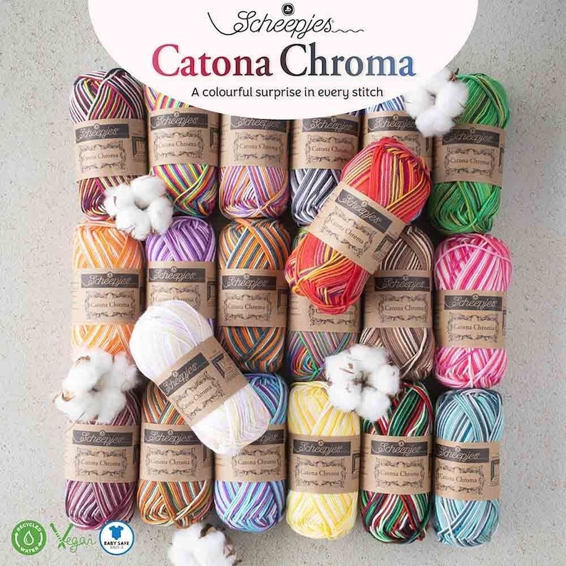 May include: A collection of colorful yarn skeins in various patterns, labeled "Scheepjes Catona Chroma." The yarn is arranged in a circle with cotton balls in the center. The label also states "A colorful surprise in every stitch."