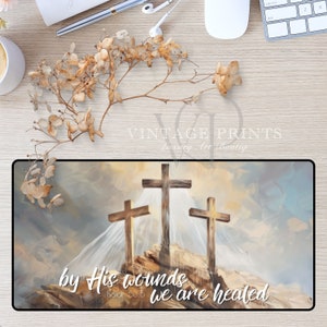May include: A painting of three wooden crosses on a hill with a cloudy sky. The text "by His wounds we are healed" is written below the crosses with the scripture reference "Isaiah 53:5".