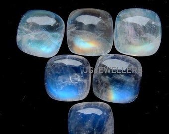 May include: Six iridescent moonstone cabochons, each with a square shape and a smooth, polished surface. The stones are a pale blue color with a hint of rainbow iridescence.