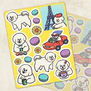 May include: A sheet of stickers featuring cartoon Bichon Frise dogs in various poses. The stickers are on a yellow background and include images of the dogs driving a car, wearing sunglasses, and holding a cup of coffee. There are also macarons and other decorative elements on the sheet.