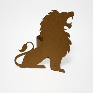 May include: A brown metal lion silhouette with an open mouth, roaring. The lion is in a seated position with its tail curled. The metal has a textured, speckled appearance. The background is plain white.