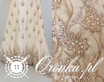 Fabric, gold lace, richly decorated with sequins and beads, fabric for a dress