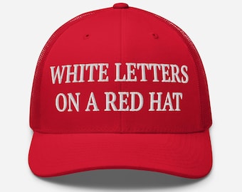 White Letters on A Red Hat Trucker Hat