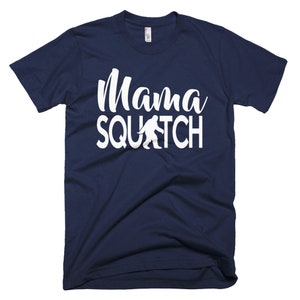 May include: A navy blue t-shirt with a white graphic that says "Mama Squatch" with a white silhouette of Bigfoot walking.