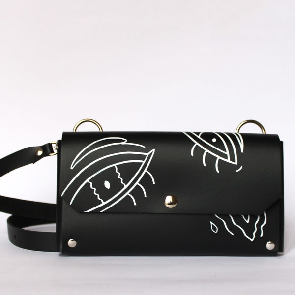Pochette téléphone LUTI  / Cuir Noir brillant et yeux blancs