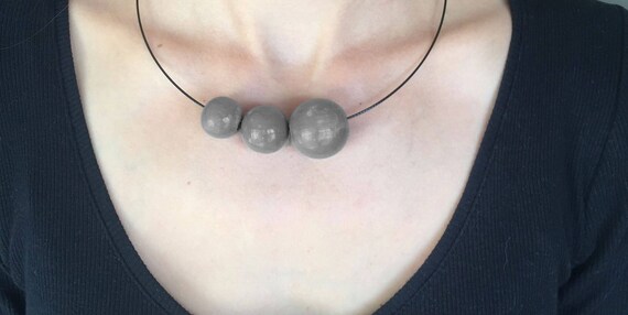 Necklace Necklace Black wood with 3 different sized beads in gray