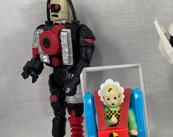 Los maniquíes de prueba de choque patinan el cochecito de bebé Kid y Junkman