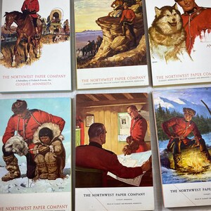 May include: A collection of vintage postcards from The Northwest Paper Company. The postcards feature illustrations of people in red uniforms, horses, dogs, and outdoor scenes. The text "The Northwest Paper Company" is printed on each card.