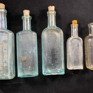 5 Antique Bottles Quackery Medicine Bottles Etc.