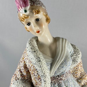 Elegant Flapper Girl Dressed In Evening Wear With Hat
