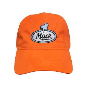 May include: Bright orange baseball cap with a curved brim. The cap features an embroidered logo of a light blue bulldog inside a white oval with the word "Mack" in a script font. The cap is made of a soft, durable fabric.