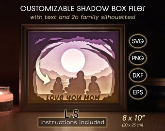 May include: A framed shadow box with a family silhouette scene, a large moon, and the text "Love you Mom." The frame is 8 x 10 inches. The image includes the text "CUSTOMIZABLE SHADOW BOX FILES" and file type icons: SVG, PNG, DXF, and EPS.