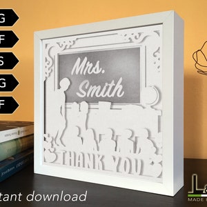 Layered shadow box design with female teacher and little girl. This customizable teacher shadowbox svg template includes SVG, PNG, PDF, DXF and EPS files for cutting machines and laser cut. Size 8x8 inches.