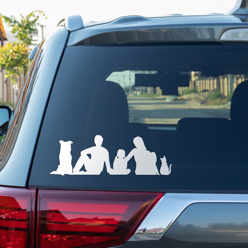 example of family silhouettes used as stickers on car rear window