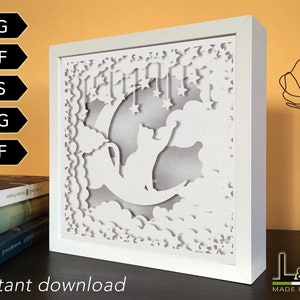 Layered shadow box design with cat on moon with stars. This cat shadowbox svg template includes SVG, PNG, PDF, DXF and EPS files for cutting machines and laser cut. Size 8x8 inches.
