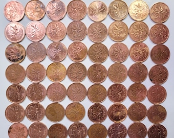 May include: A collection of 100 copper Canadian one-cent coins arranged in a grid pattern. Each coin features a maple leaf design and the text "CANADA" and "1 CENT".