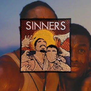 May include: Embroidered patch with the word "SINNERS" in white on a black background. The patch features an illustration of two men with a yellow sun and hands reaching down. The patch is square.