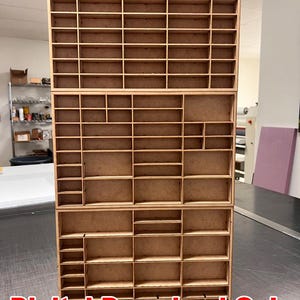 May include: Three-tiered wooden organiser with numerous small compartments. The compartments are arranged in a grid-like pattern, suitable for storing small items. The text "Digital Download Only *not physical product" is at the bottom.