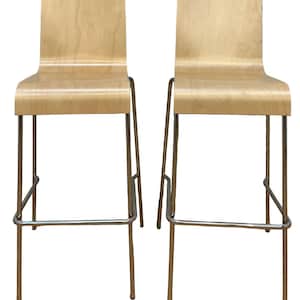 May include: Two modern bar stools with light wood seats and curved backs. The stools have slender, silver-colored metal legs and a footrest. The design is minimalist and contemporary, suitable for a kitchen or bar setting.
