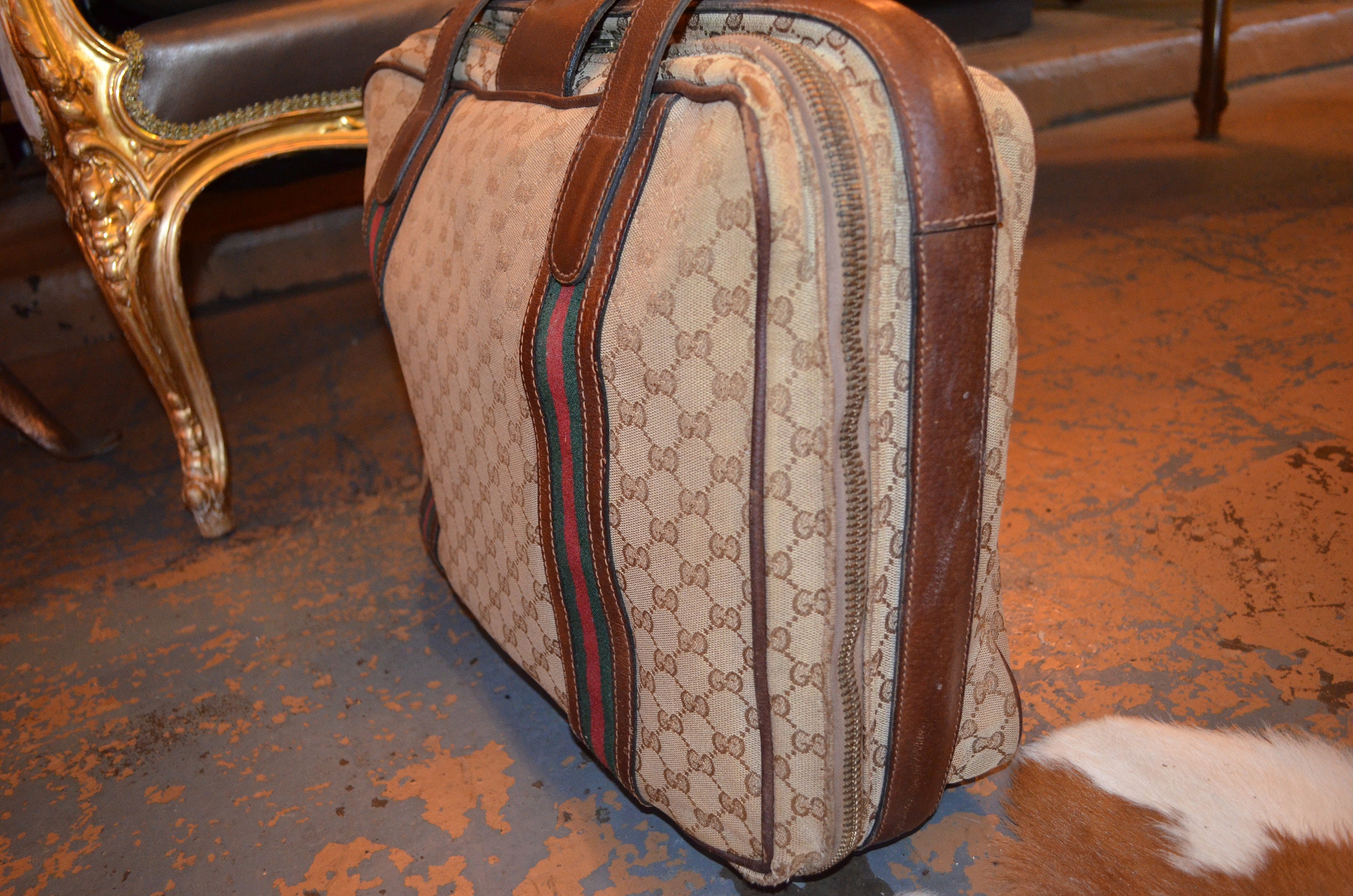 Gucci - Continuing its 100-year legacy in luggage, the House presents a  selection of Ophidia travel bags defined by a blue rendering of the GG  monogram and Web motif. In a special