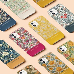 May include: A collection of floral patterned phone cases in various colors, including blue, yellow, and pink. Each case features a unique design and a contrasting bottom section with a name printed on it, such as "Sophia Williams" and "Victoria Jones".