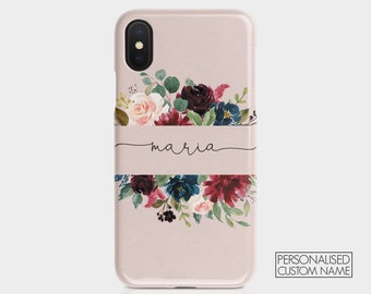 May include: A pink iPhone case with a floral design and the name "maria" written in cursive on a white banner.