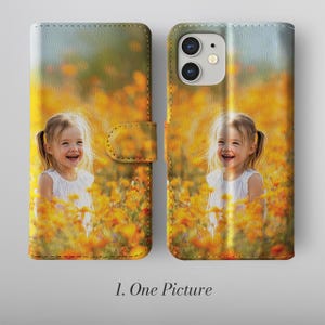 May include: A leather phone case featuring a photograph of a smiling child in a field of yellow flowers. The case is open, showing the phone's screen and camera. The text "1. One Picture" is printed at the bottom.