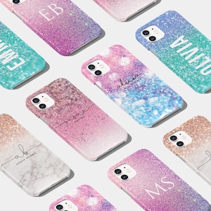 May include: A collection of personalized phone cases with glitter and ombre designs. The cases feature names like "Olivia", "Alicia", "Amber Brown", and "Susan Davies", as well as initials like "EB" and "MS".